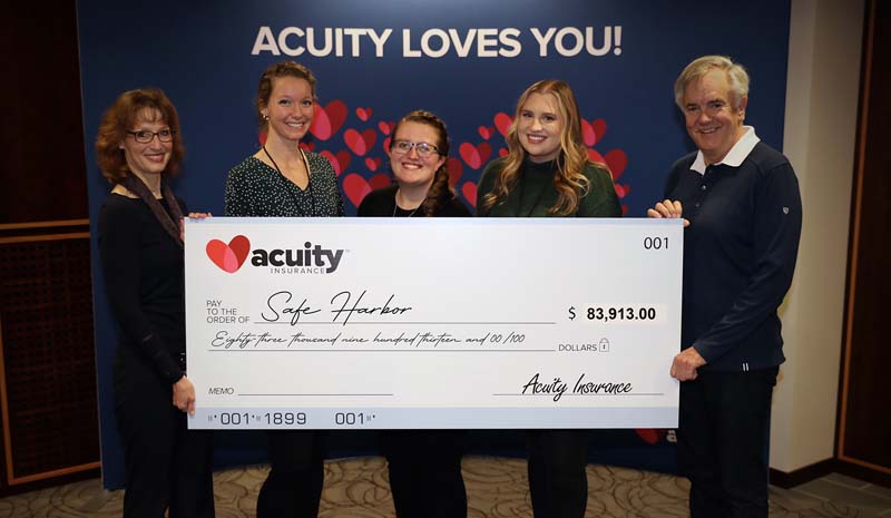 Acuity’s Sheri Murphy and Ben Salzmann present a check for nearly $84,000 to Safe Harbor’s Britta West, Courtney Stewart, and Vanessa VanderWeele. The donation was one of six year-end donations made to charitable organizations for a total of $350,000.