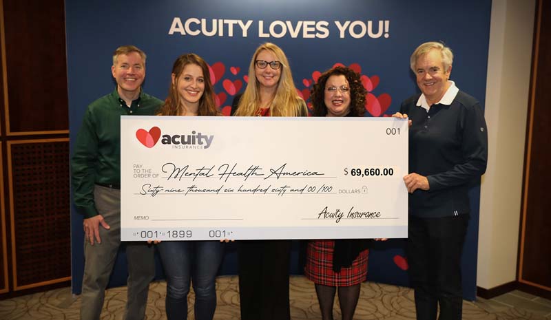 Dana Bear, Julie Preder, and Kristal Klemme from Mental Health America accept a check for nearly $70,000 from Acuity’s Adam Norlander and Ben Salzmann.