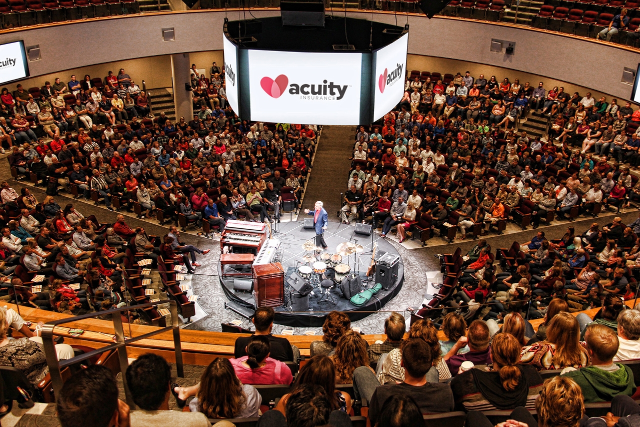 Acuity President and CEO Ben Salzmann speaks to employees during a town hall meeting.