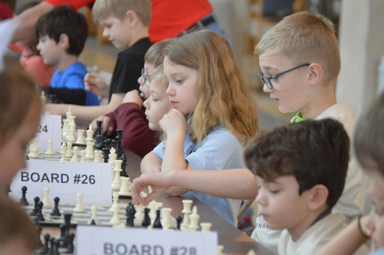 Students concentrate while planning their next move in the 2018 Acuity Invitational chess tournament.