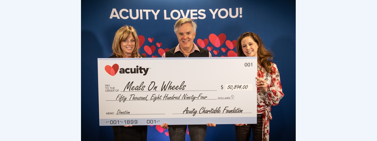 Meals on Wheels: Meals on Wheels of Sheboygan County CEO Kelly Heyn (left) accepts a check for nearly $51,000 from Acuity President and CEO Ben Salzmann and Melissa Winter, Vice President - Business Consulting.