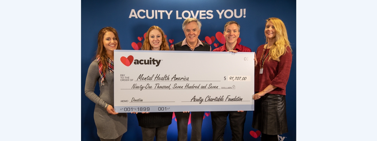 Mental Health America: Acuity Product Analyst Dana Bear (far left), President and CEO Ben Salzmann (middle), and Controller Adam Norlander present a check for nearly $92,000 to Trisha Erpelding, Education Coordinator (left), and Julie Preder, Executive Director, Mental Health America in Sheboygan County.