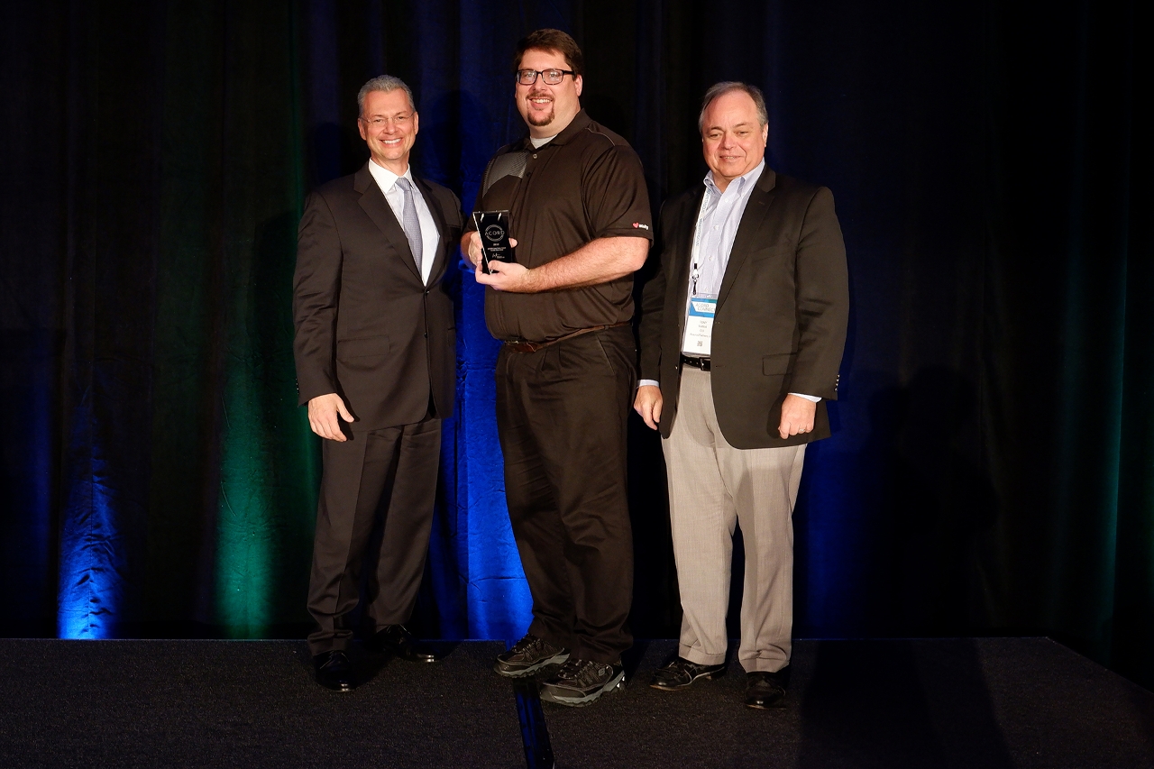 Mike Nickels, Acuity Senior Systems Architect (center) accepted Acuity’s ACORD Case Study Award from Bill Pieroni, President & CEO of ACORD (left) and ACORD Board of Directors member Tony Mattioli.