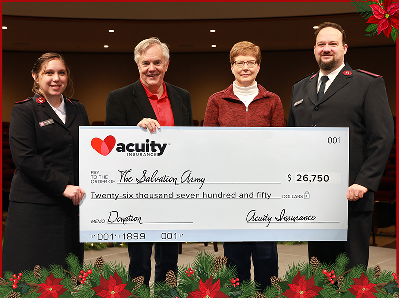 The Salvation Army: Lt. Wiley and Lt. Heather Gladney of The Salvation Army accept a check for over $26,000 from Acuity’s Wendy Schuler and Ben Salzmann.