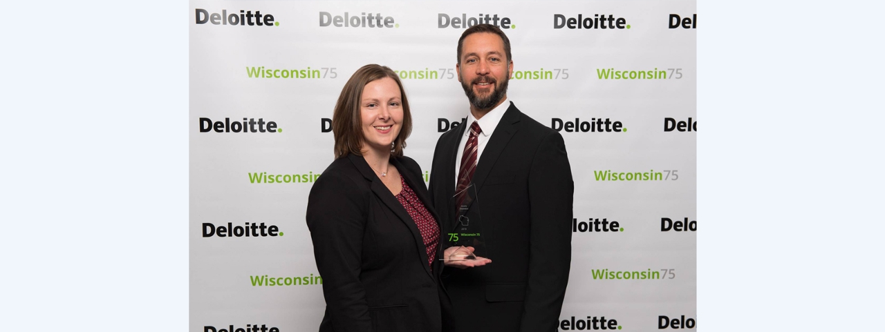 Stacey Haskett, General Manager - Business Systems, and Paul Miller, Manager - Communications, receive the Deloitte Wisconsin 75 award on behalf of Acuity.